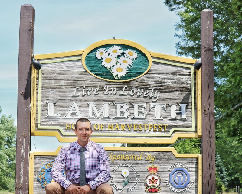 Matt Millar in front of the Lambeth, Ontario town sign